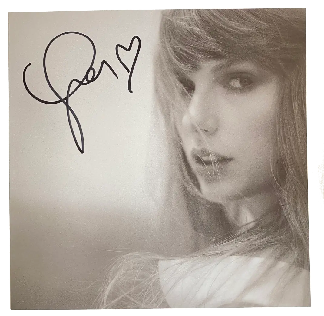 Photo signed by Taylor Swift which is included as an insert with some vinyl copies of The Tortured Poets Department.